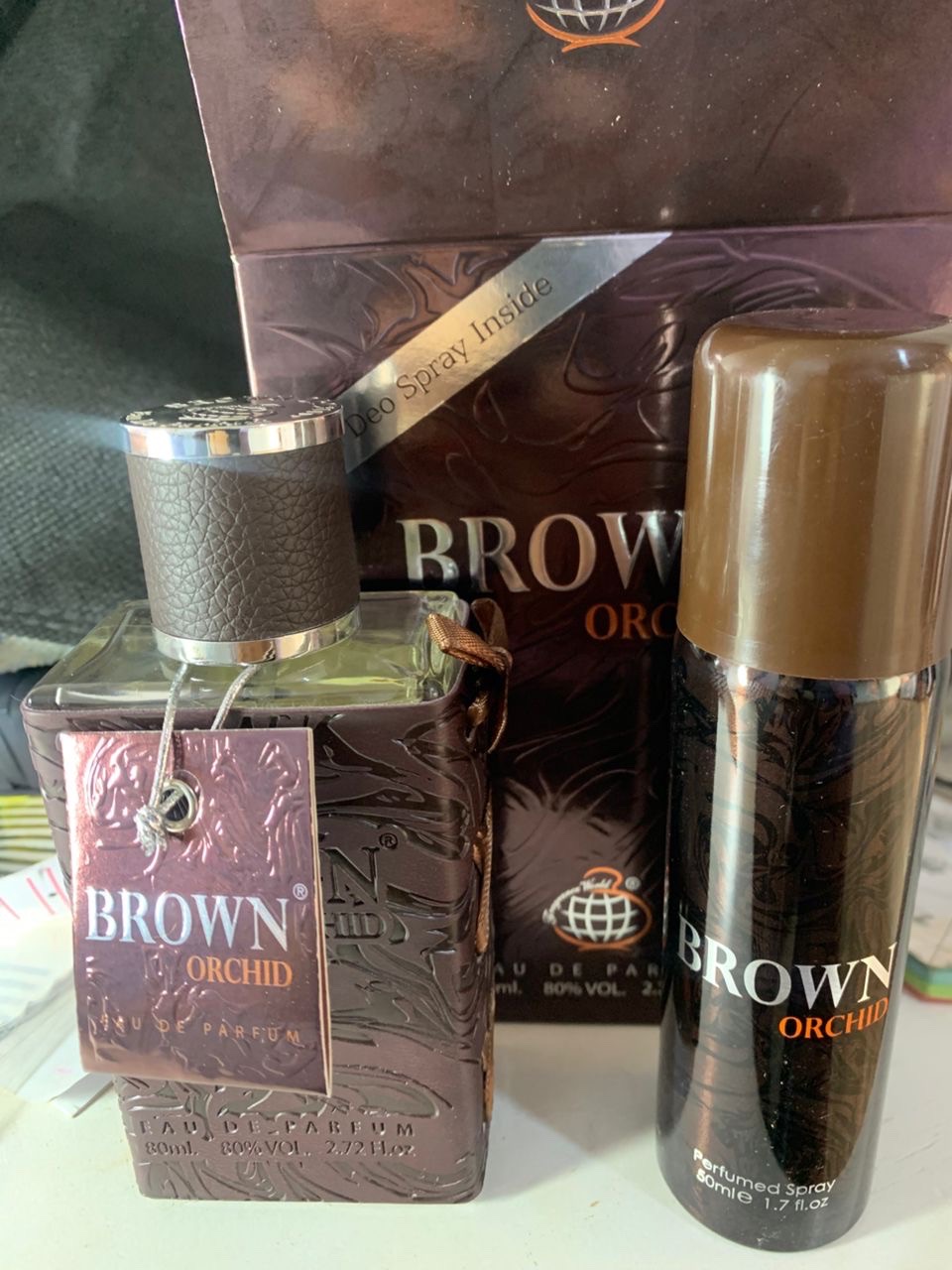 Brown orchid spray and perfume